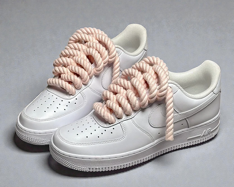 White Nike Air Force 1 customized with 1.0 peach cotton rope laces for a soft summer aesthetic.