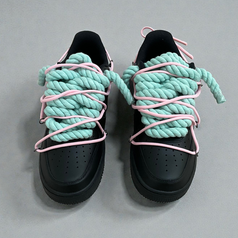 Close-up detail of the hand-laced 1.0 Tiffany Blue rope and pastel pink secondary lace on black leather.