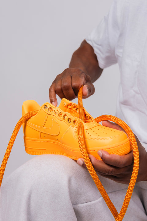 Detailed shot of making Nike AF1, rope lace 2.0, showing the superior quality of the Golden Yellow cord