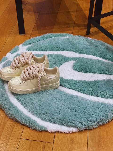 Tiffany Blue plush rug as a display for custom sneakers.