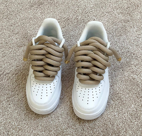 Side by side view of the white custom Air Force 1 showing the gold 2.0 rope laces tucked neatly for a clean tactical finish.