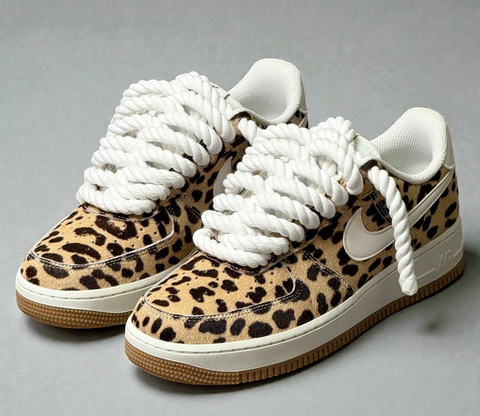 Side profile of Leopard Print Nike Air Force 1 sneakers with thick 1.0 white cotton rope laces and a classic gum sole.