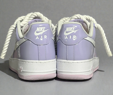Heel-angle shot of custom patent lilac Air Force 1s, emphasizing the high-gloss finish and 1.0 cotton