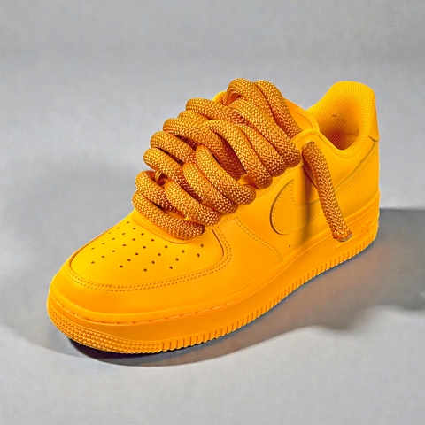 Front profile of Nike Air Force 1 Rope Lace 2.0 in Golden Yellow with waterproof technology.