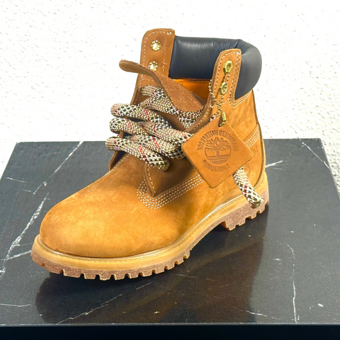 Classic wheat brown Timberland 6-inch boots featuring 2.0 upgraded tan waterproof rope laces.